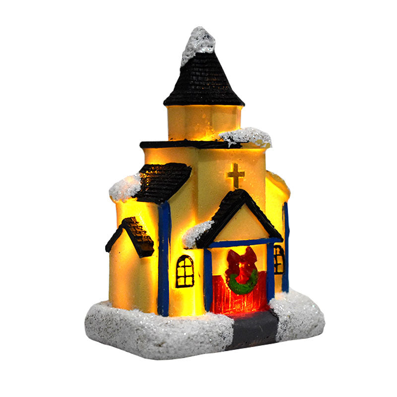 Illuminated Christmas house made of resin with snow effect