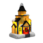 Illuminated Christmas house made of resin with snow effect