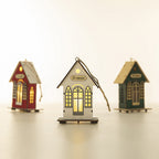 Illuminated wooden house for Christmas decoration