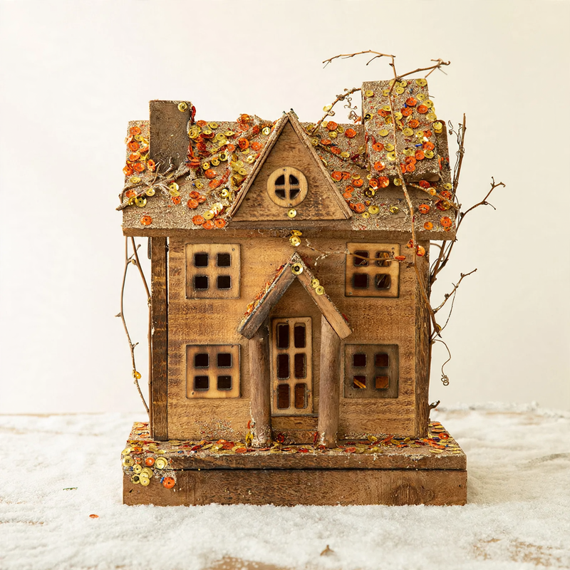 Illuminated wooden snow house in European style