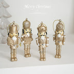 Golden nutcracker pendant made of resin for the Christmas tree
