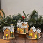 Illuminated wooden house for Christmas decoration