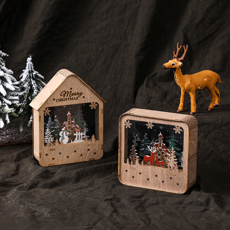 Illuminated wooden house with LED Christmas decoration