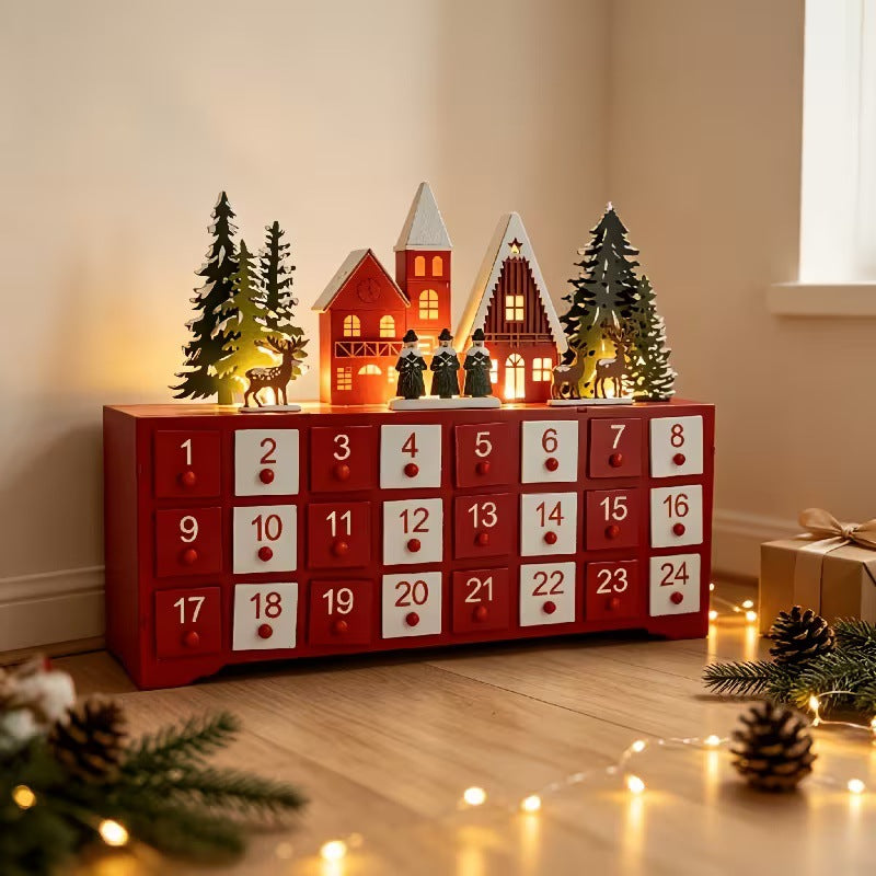 Illuminated wooden Advent calendar in village design