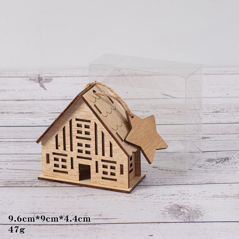 Illuminated wooden house for Christmas decoration
