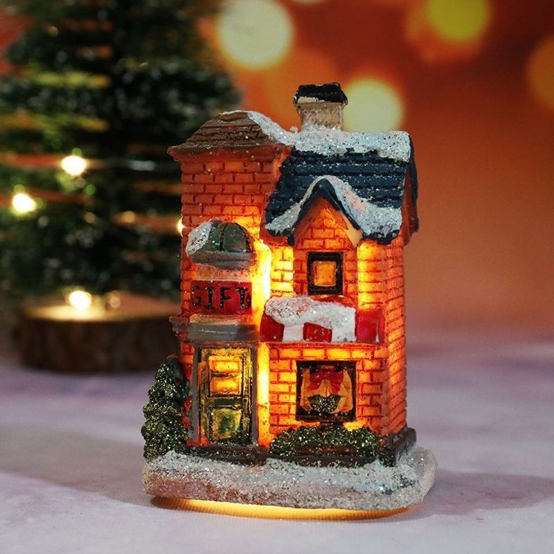 Illuminated Christmas house made of resin