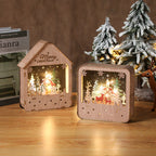 Illuminated wooden house with Christmas motif