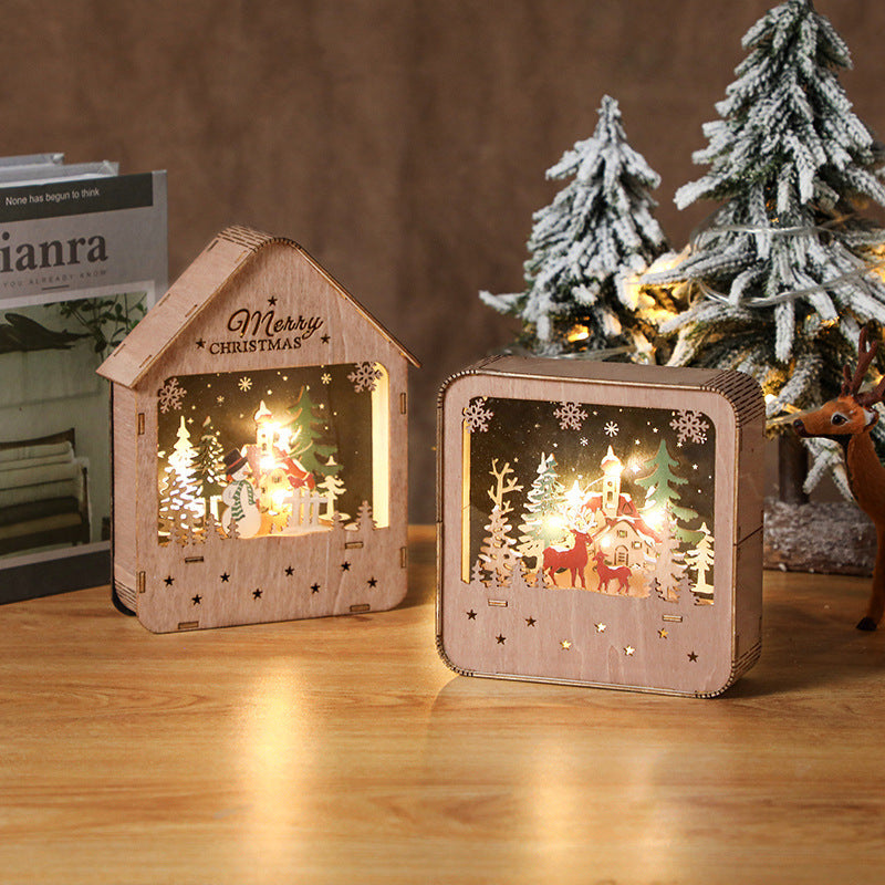 Illuminated wooden house with Christmas motif