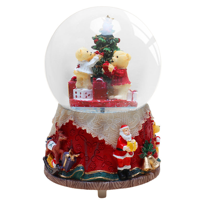 Decorative music box with snow globe motif