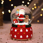 Illuminated snow globe music box, resin