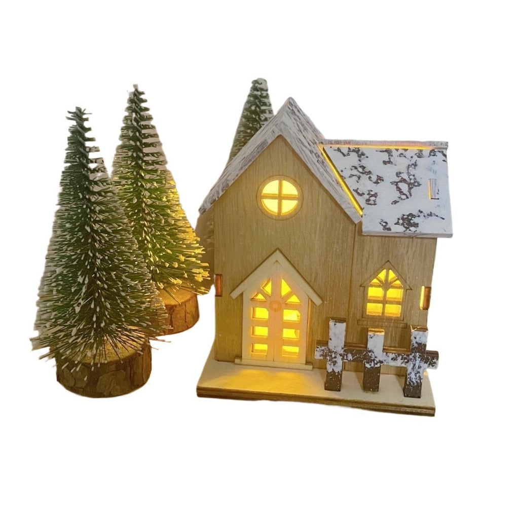 Illuminated Wooden Christmas House with Snow Landscape