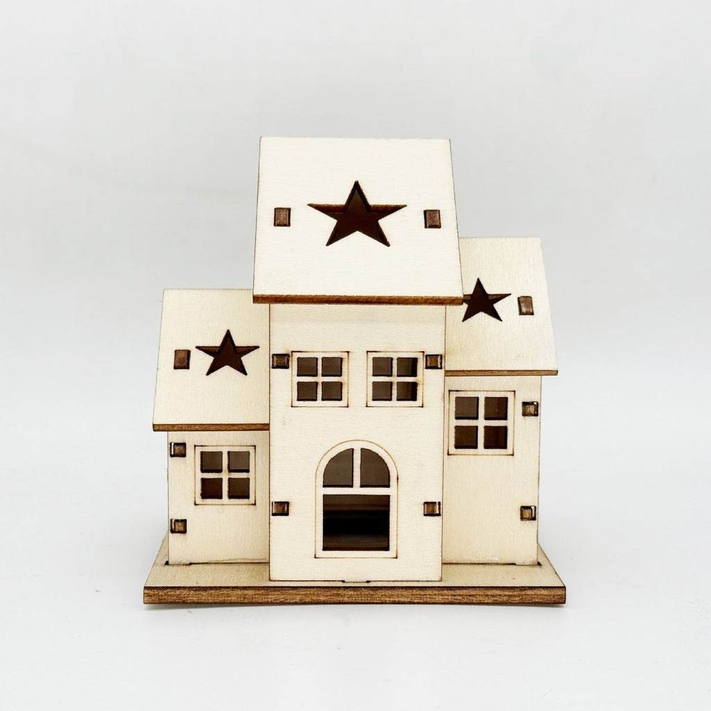 Illuminated wooden house for Christmas decoration