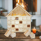 Illuminated wooden Advent calendar in cabin design
