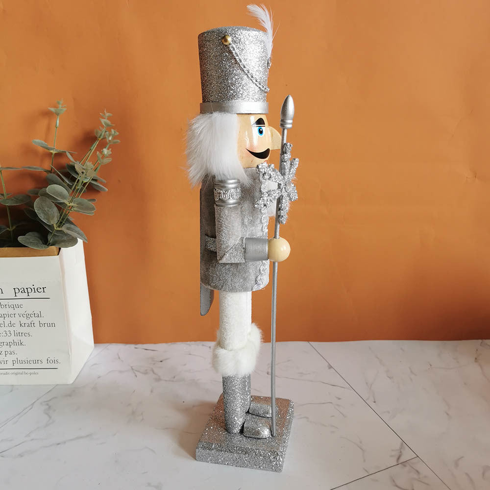 Decorative nutcracker figure made of wood with snowflake design