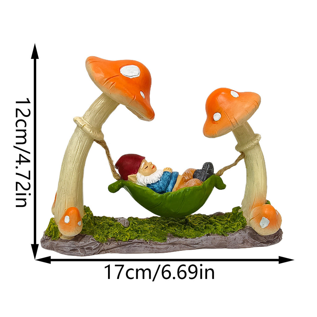 Garden decoration gnome in hammock made of synthetic resin