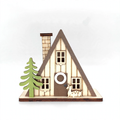 Illuminated wooden house in triangular shape