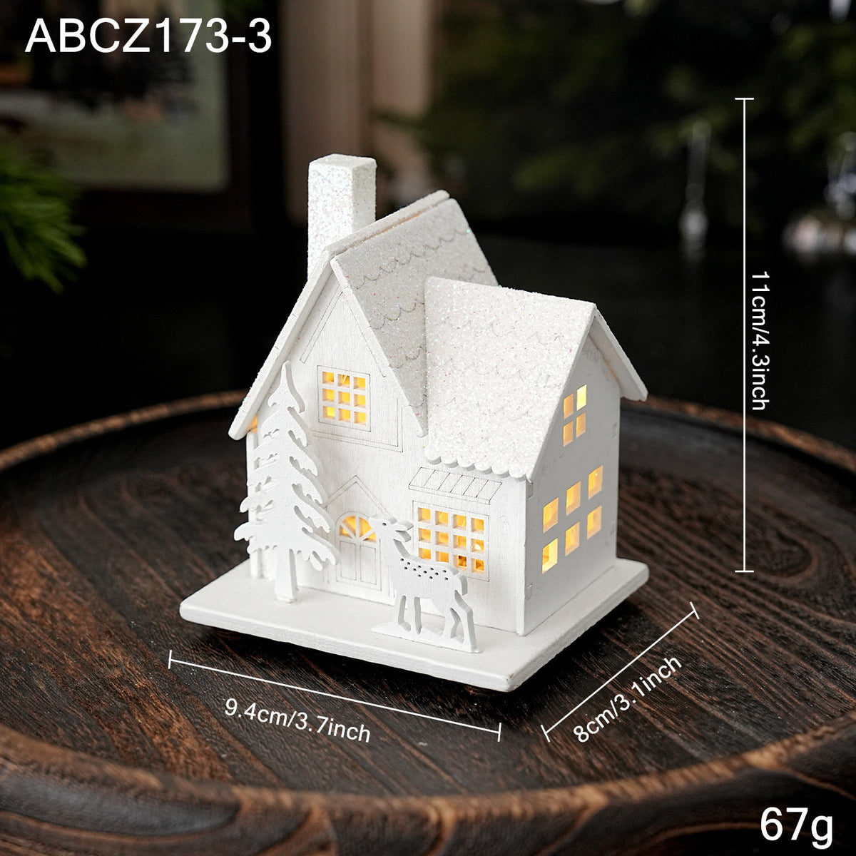 Illuminated wooden house for Christmas decoration