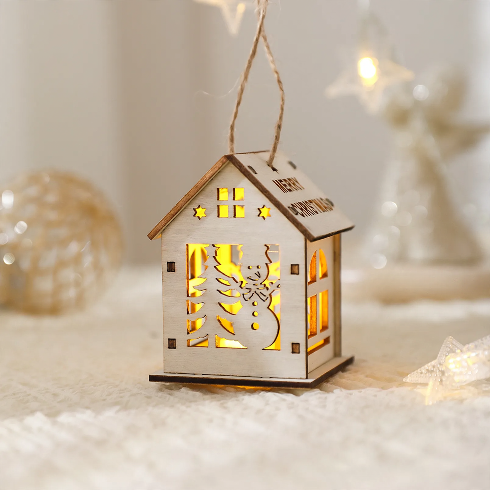 Illuminated wooden house as Christmas decoration
