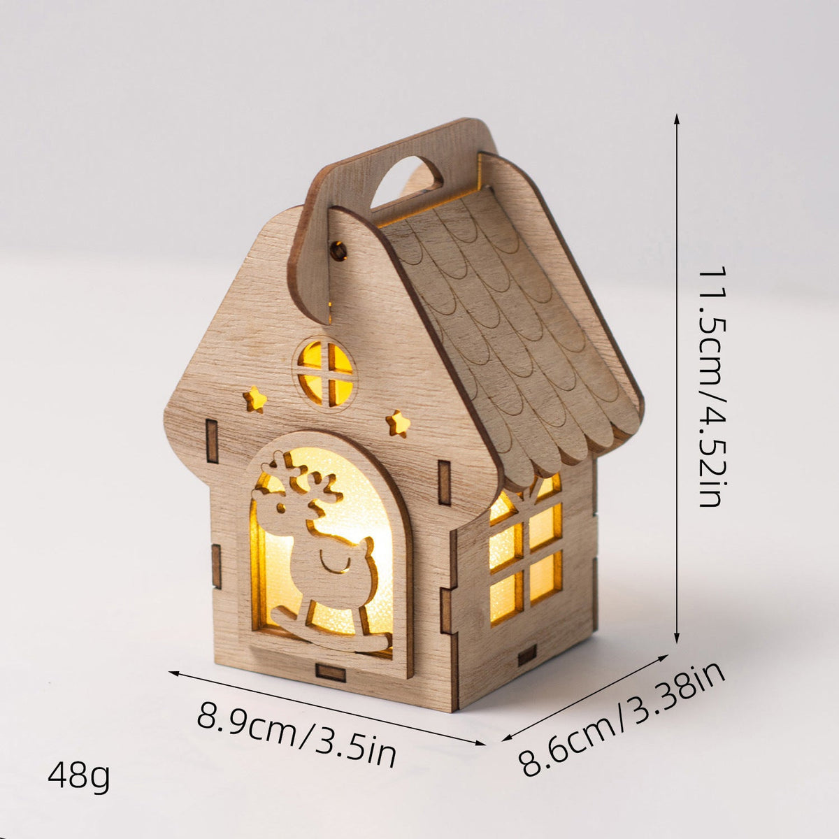 Illuminated wooden house as Christmas decoration