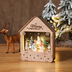Illuminated wooden house with LED Christmas decoration