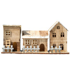 Illuminated wooden Christmas house in Scandinavian style