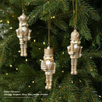 Golden nutcracker pendant made of resin for the Christmas tree