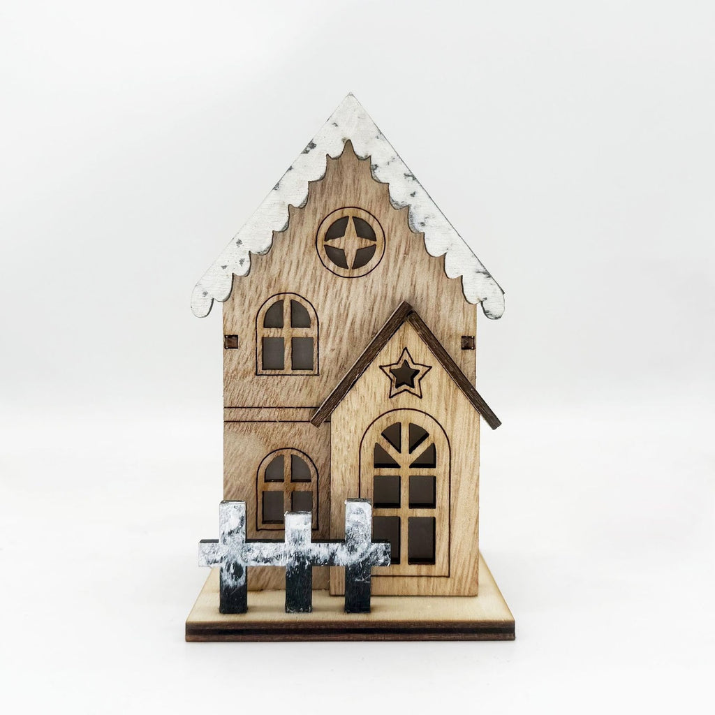 Illuminated wooden Christmas house with LED