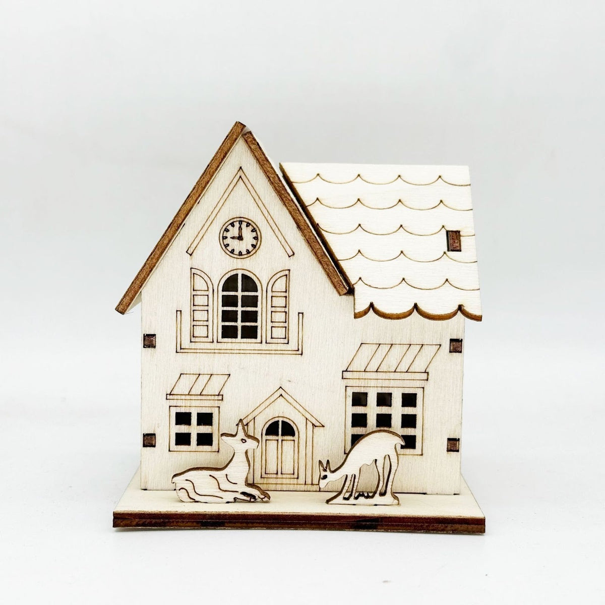 Illuminated wooden house for Christmas decoration