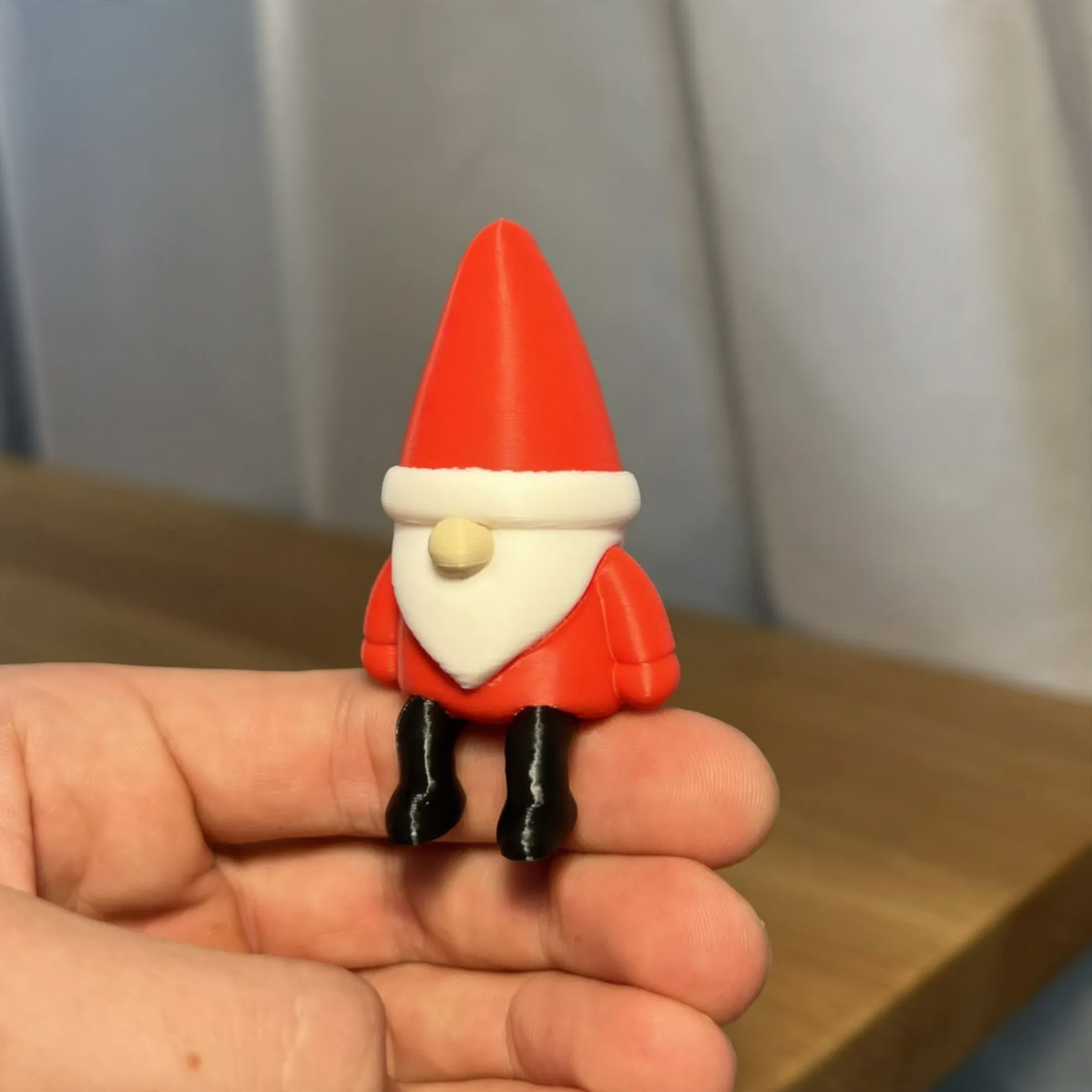 Miniature Santa Claus figure, sitting