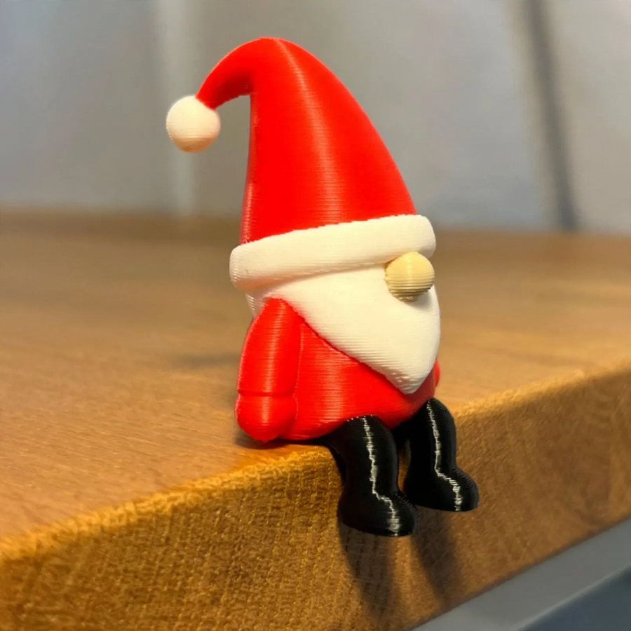 Miniature Santa Claus figure, sitting