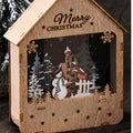 Illuminated wooden house with LED Christmas decoration