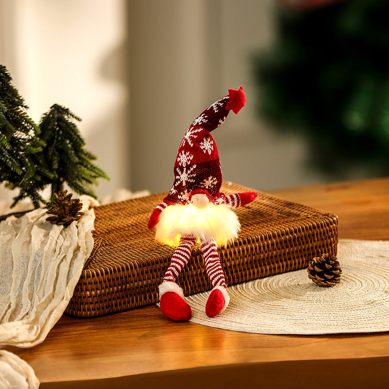 Illuminated gnome figure, sitting, with knit hat