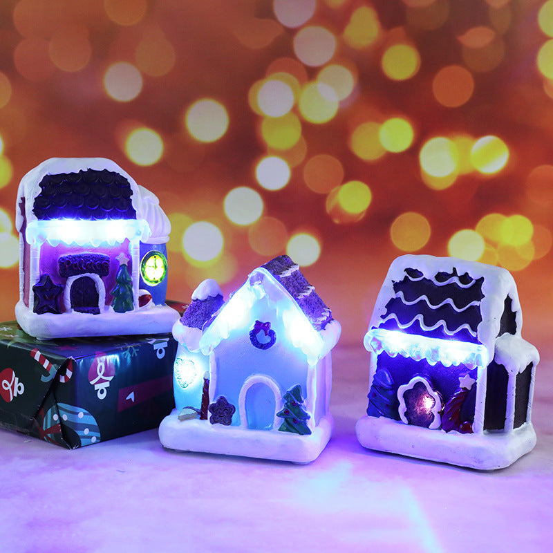 Illuminated miniature Christmas house made of resin