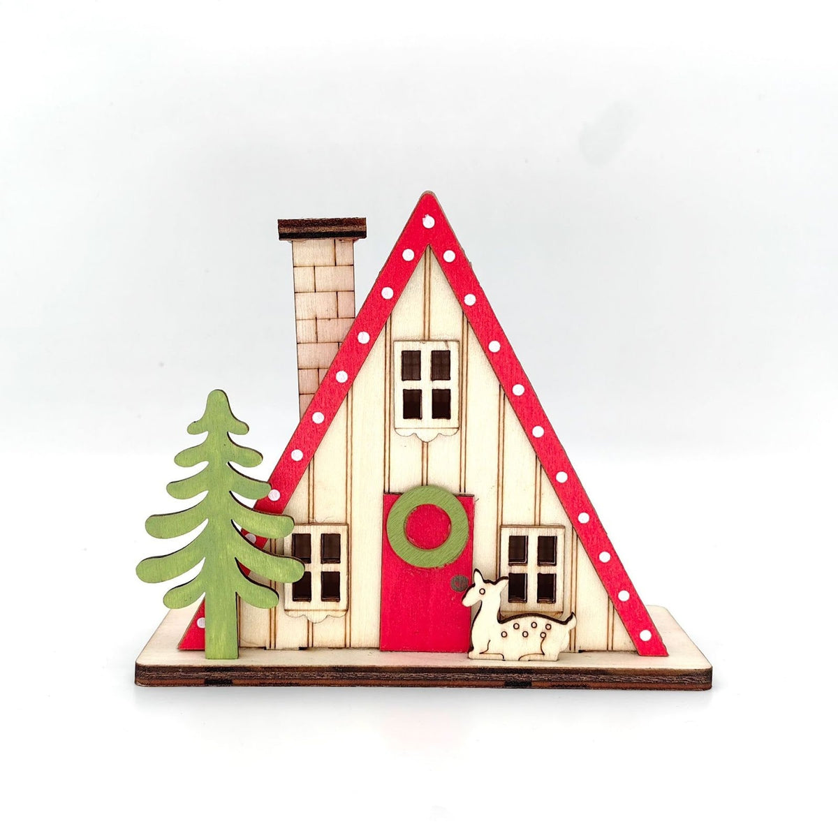 Illuminated wooden house in triangular shape