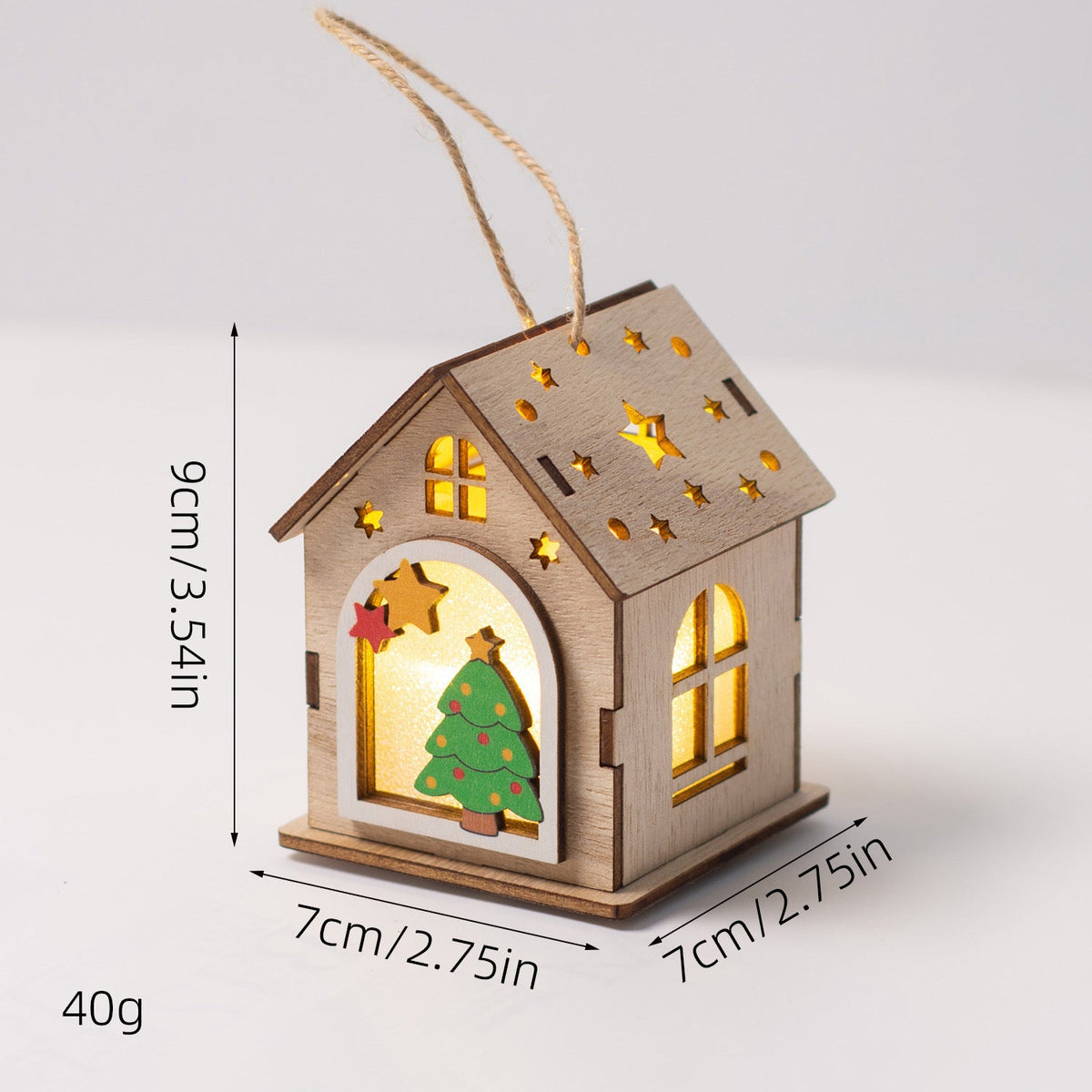 Illuminated wooden house as Christmas decoration
