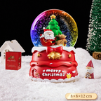 Christmas snow globe with music box and carriage design