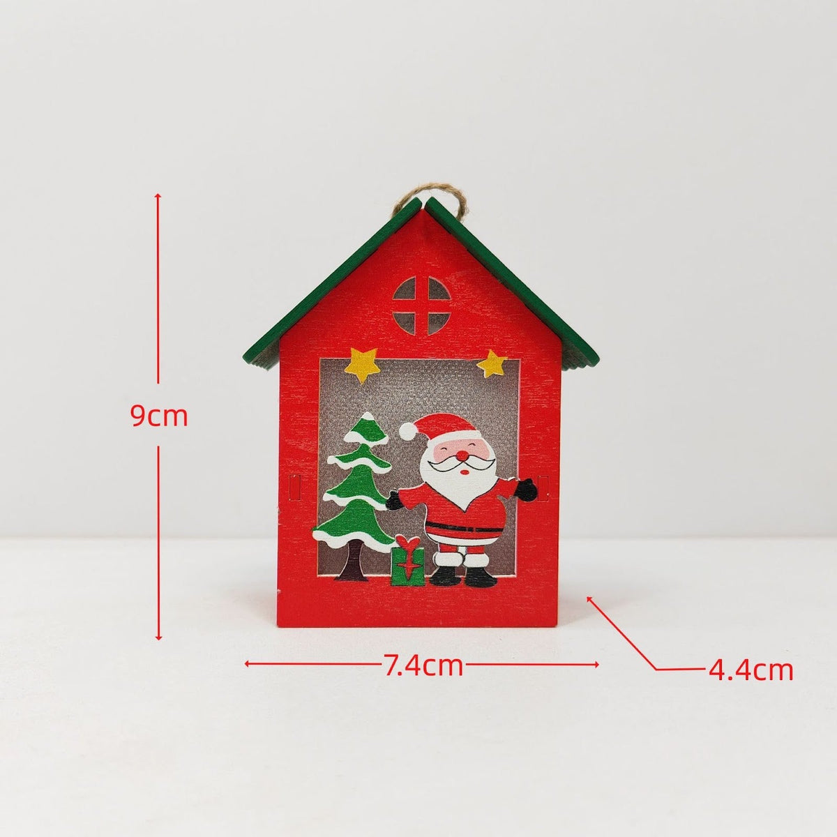 Illuminated wooden house for Christmas decoration