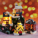 Illuminated miniature Christmas house made of resin