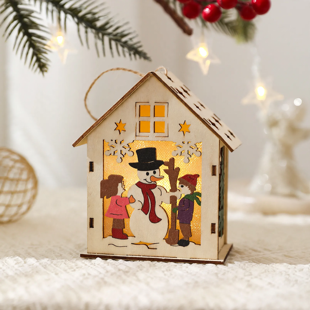 Illuminated wooden house as Christmas decoration