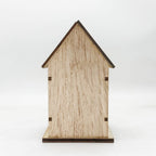 Illuminated wooden Christmas house with LED