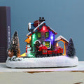 Illuminated Christmas village house made of resin