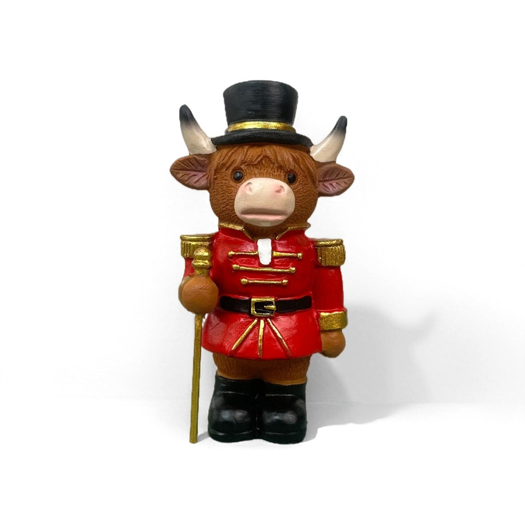 Decorative nutcracker and highland cattle figures made of resin