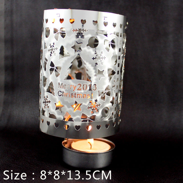 Rotating tea light holder made of brass, openwork design