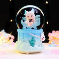 Fairy-tale snow globe with music and light