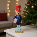 Decorative nutcracker figure with bear, synthetic resin